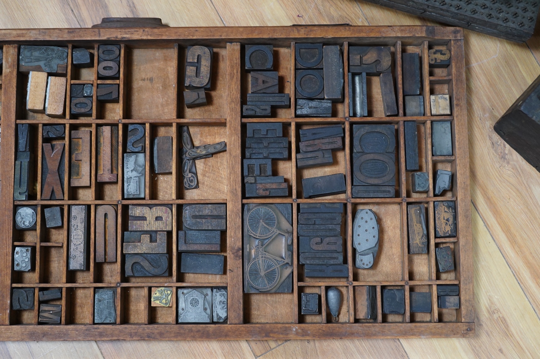 A printer's tray and various type-sets